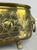 A striking Vintage brass decorative pot , featuring an oval form with elaborate raised floral and rose decoration,...