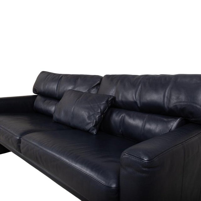 Three-seater sofa from the German manufacturer Brühl, whose black leather and clean, cubic design add a modern touch to...