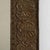 A decorative Arts & Crafts mirror featuring a hand-worked copper frame with repoussé detailing. The textured metal surface...