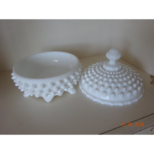 Fenton White Hobnail Milk Glass footed and covered bowl displayed on a hutch buffet to hold matches to light candles on...