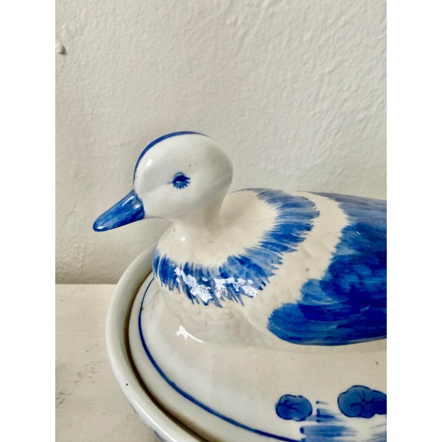 Vintage blue and white hand painted duck shaped dish with lid.