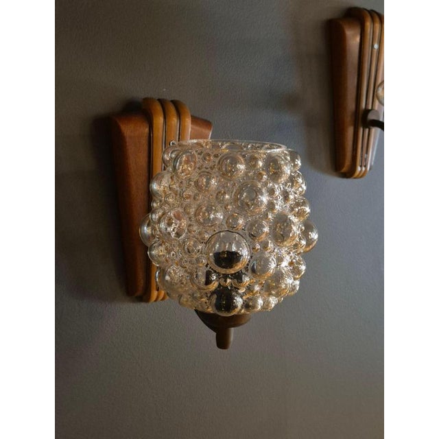 A pair of rare, decorative wall lights by Helena Tynell, Scandinavian/Finnish Modern mid-1900s. Glass with beautiful...