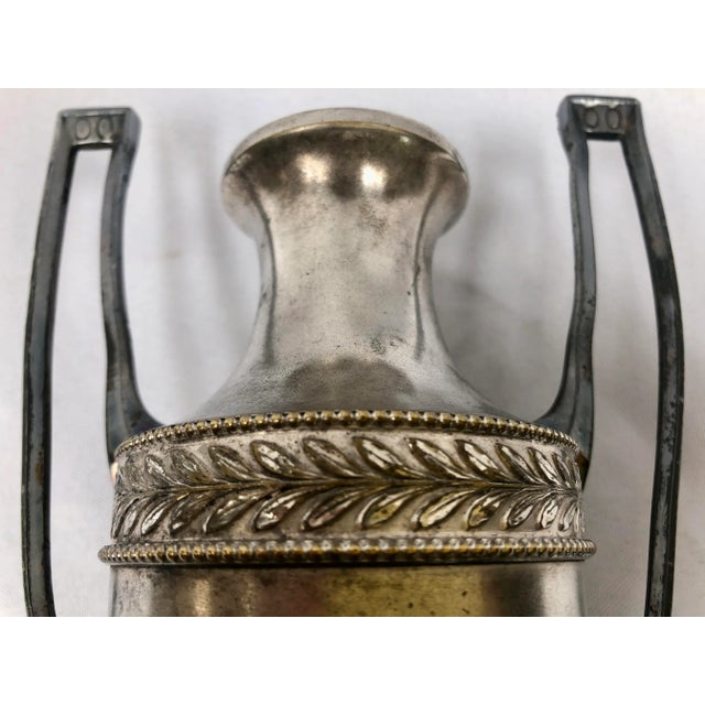 Pair of antique art noveau urns. Incredible detailing with animal feet, embossed legs and crown, and art noveau stylized...