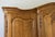Vintage Louis XVI French Oak Four Door Carved Armoire For Sale - Image 3 of 11