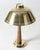Elegant table lamp by Hans Bergström, made from brass and teak. Handle embossed with decorative stripes. This piece has an...