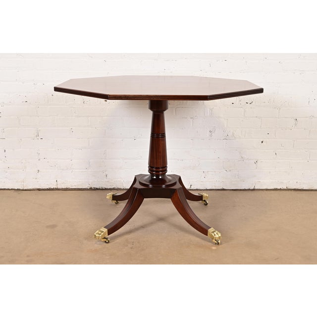 An exceptional Georgian or Regency style pedestal dining table, center table, breakfast table, or game table By Baker...