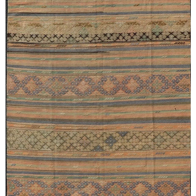 Orange Mid 20th Century Mid 20th Century Vintage Striped Turkish Kilim Rug With Geometric Shapes and Soft Muted Colors For Sale - Image 8 of 12