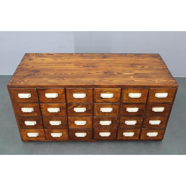 This original 1940s bank drawer cabinet from Czechoslovakia is a rare example of early industrial and office furniture,...