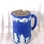 This is a dark blue Wedgwood Jasperware trojan jug or pitcher with a metal cap that may be used for coffee, tea, or other...