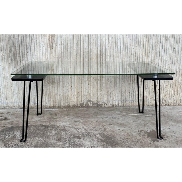 About Mid-Century Modern black metal table with glass top and nickel supports. Details Dimensions Height: 37 in. (93.98...