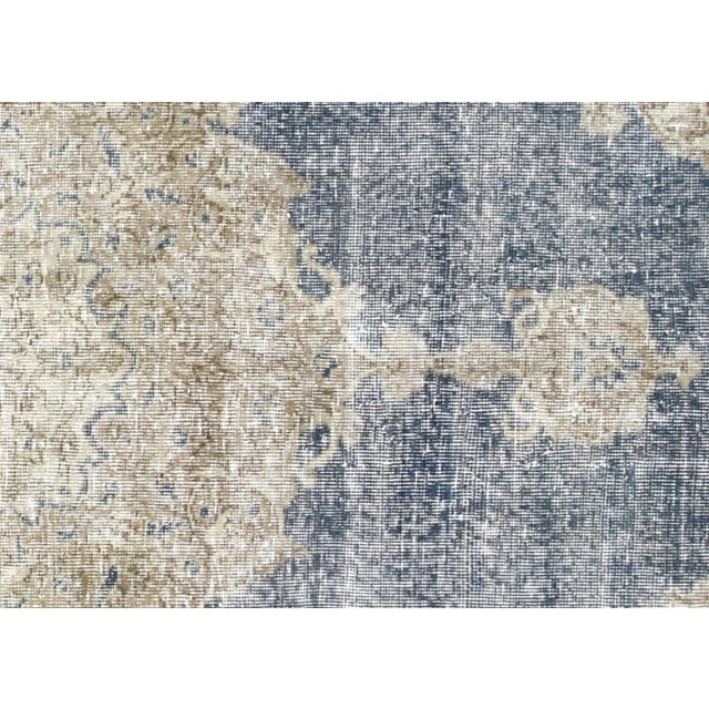 Exquisite vintage Turkish Oushak rug, hand-crafted with traditional wool-on-wool construction in Western Turkey's...