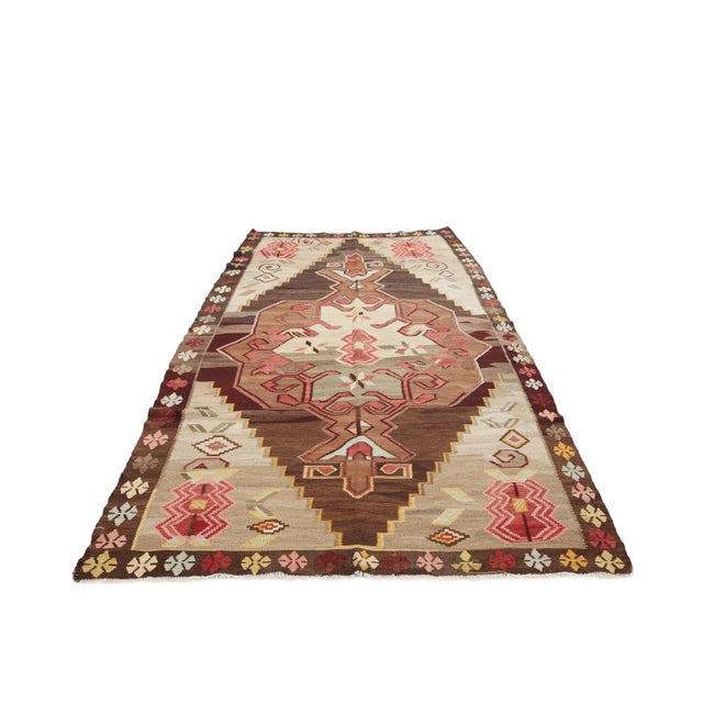 Vintage handwoven decorative kilim rug from Kars region of Turkey. Approximately 50-60 years old. In very good condition.
