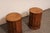 An Italian pair of column-style wooden side cabinets with round marble tops. These vintage tables from Italy have round...