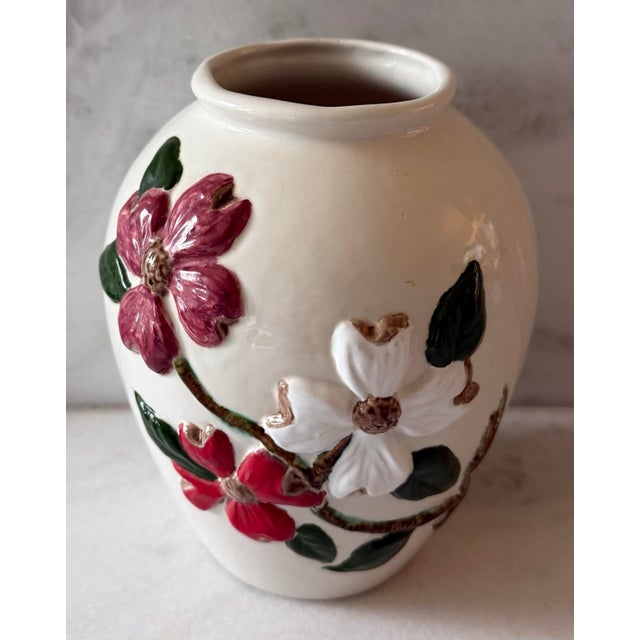 Vintage 1970s ceramic vase with embossed red and white dogwood flowers with green leaves. Beautiful alone or used to...