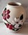 Vintage 1970s ceramic vase with embossed red and white dogwood flowers with green leaves. Beautiful alone or used to...
