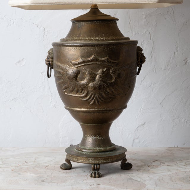 A Russian brass double-headed eagle lamp, mid-20th Century. 11 inches wide by 9 inches deep by 30 ¼ inches tall; shade...
