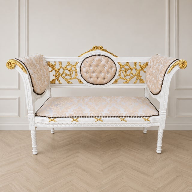 Add timeless French elegance to your interior with this exquisite white French-style settee, beautifully accented with...