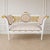 Add timeless French elegance to your interior with this exquisite white French-style settee, beautifully accented with...