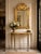 Bring timeless elegance to your home with this beautifully restored neoclassical console table and matching mirror....