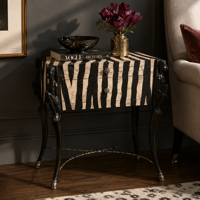 A striking tessellated stone side table attributed to Maitland-Smith, featuring a bold zebra pattern motif rendered in...