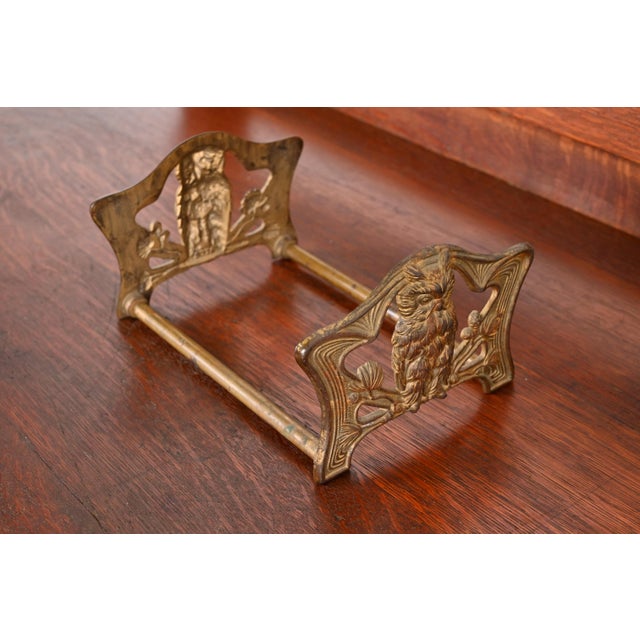 A gorgeous Art Nouveau period bronze expandable book rack or bookends with owl motif In the manner of Bradley & Hubbard...