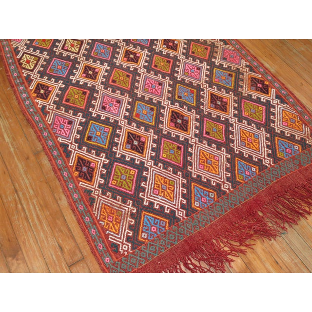Colorful midcentury Turkish Jajim. Dominant Accents in bright pink, orange, electric blue Measures: 3'8” x 6'9” With the...