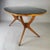 Ico Parisi-style table, an elegant Italian design from the 1950s. Frame with woven beech wood legs, oval black glass top....