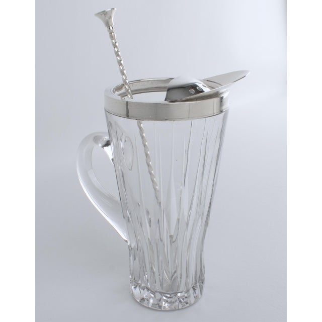 Christofle designed and crafted this elegant barware Martini cocktail pitcher in France, circa 1940. The modernist bar...