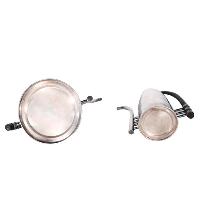 Chic, voguish set of two silver-plate serve ware pieces designed by noted Italian silversmith and designer Lino Sabittini,...