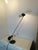 Handle-style table lamp designed by D'Urbino, Lomazzi, and De Pas for Stilnovo Italia. Excellent functionality. Good...