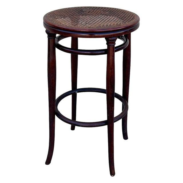 Victorian bent oak & cane bar stool by Thonet an elegant, sculptural frame crafted from warm-toned bentwood with striking...