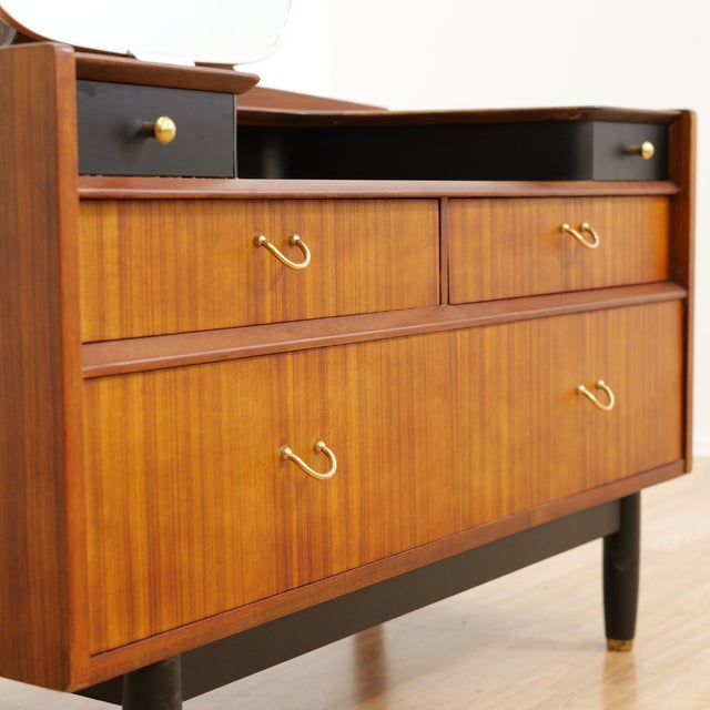 This mid-century vanity dresser was produced by E Gomme (G Plan). Made from light oak during the 1960s, with three drawers...