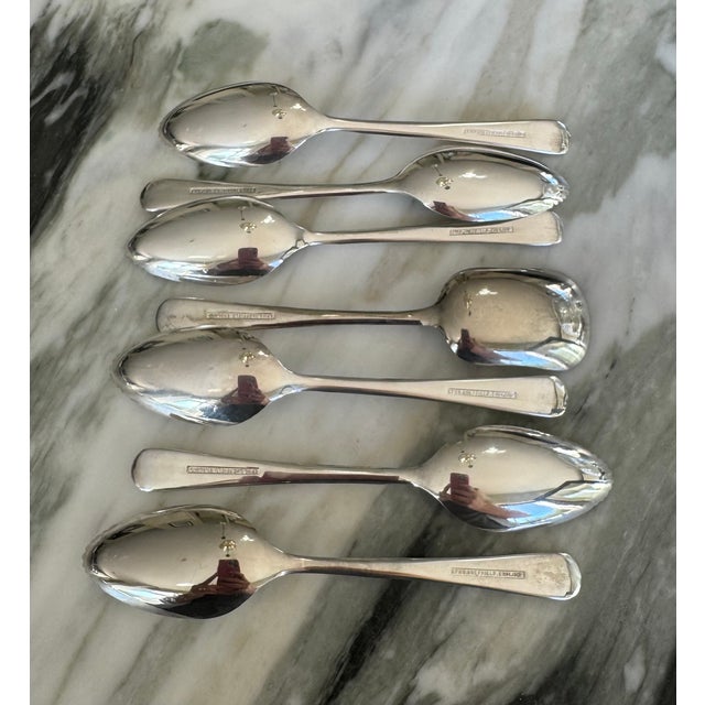 Presenting a vintage set of silver electroplate breakfast spoons in their original storage case. There are six serrated...