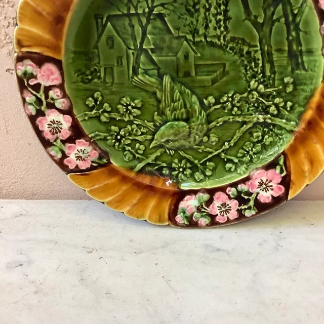 19th Majolica bird plate signed Sarreguemines. This plate represent the Spring with cherries flowers.