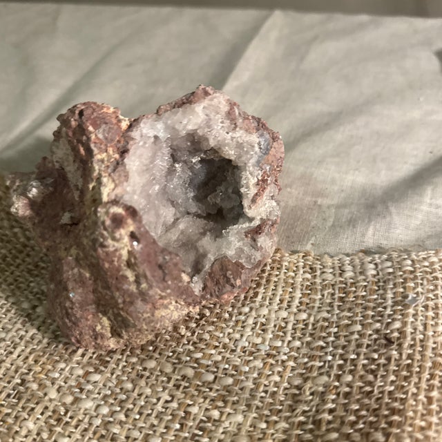 An impressive and visually striking white quartz crystal geode, thoughtfully selected for its dramatic natural formation...