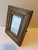 A single vintage rectangle wood micro mosaic inlaid picture frame finished with glass and standing back. Opening measures...
