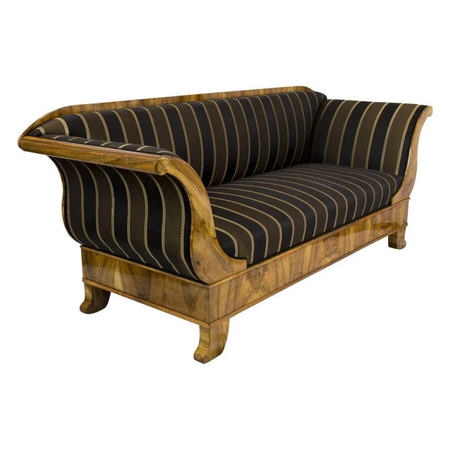 The sofa dates from the Biedermeier period at the beginning of the 19th century. The body of the sofa is made of spruce...