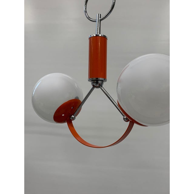 chandelier with 2 lights attributed to stilnovo. approximately 1970s. it is a warehouse find and does not have many signs...