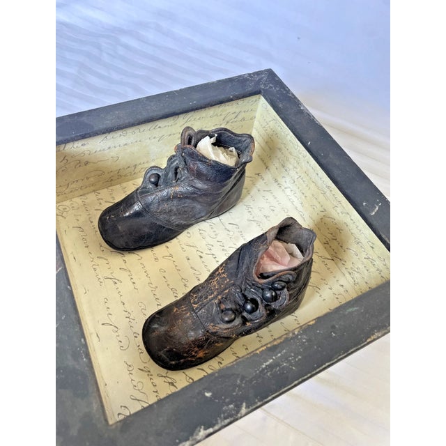 Framed antique baby shoes. Victorian, Made of black leather with little buttons. Perfect for those who appreciate...