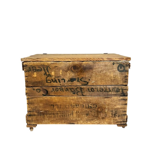 Antique wood crate from a barber company in Nebraska. Crate has graphic black writing on the side and lid. Crate stamped...
