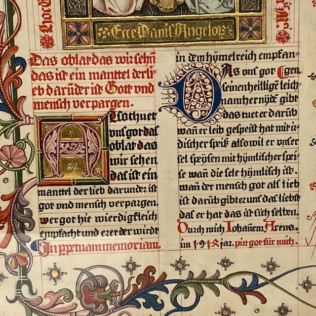 DETAILS A fine antique, illuminated manuscript with a miniature painted scene on paper of two angels supporting a...