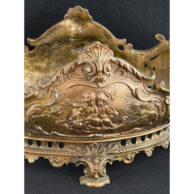 Magnificent French Rococo Revival bronze centerpiece jardinière, richly cast and chased with satyr masks, putti and...