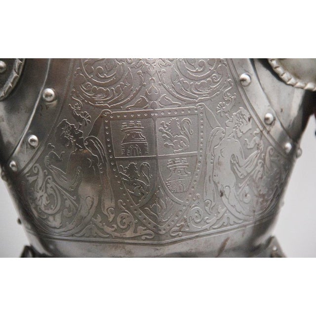 An impressive early 20th miniature suit of armour in the 16th Century style, possibly German, the helmet is adjustable and...