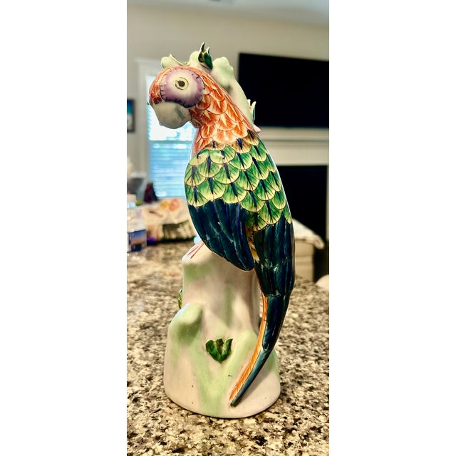 Large colorful ceramic parrot on a branch in very good vintage condition.