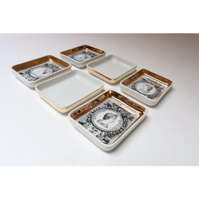 Collection of six porcelain vide-poches/trinket dishes designed by Piero Fornasetti (ca. 1960s, Italy). Four from the...
