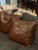 Beautiful pair of vintage leather throw pillows with a rich, warm brown finish that brings an instant sense of cozy,...