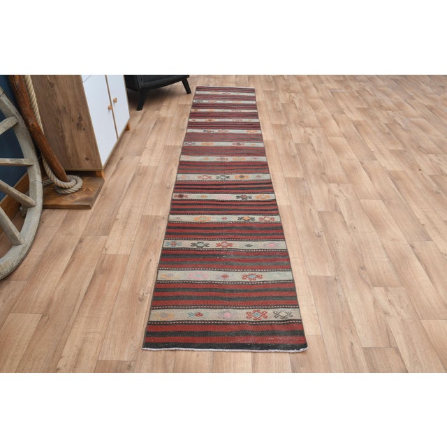 Vintage Turkish Hand-Knotted vintage rug is a semi-antique vintage runner rug. The '70s Eastern region of Turkey's unique...