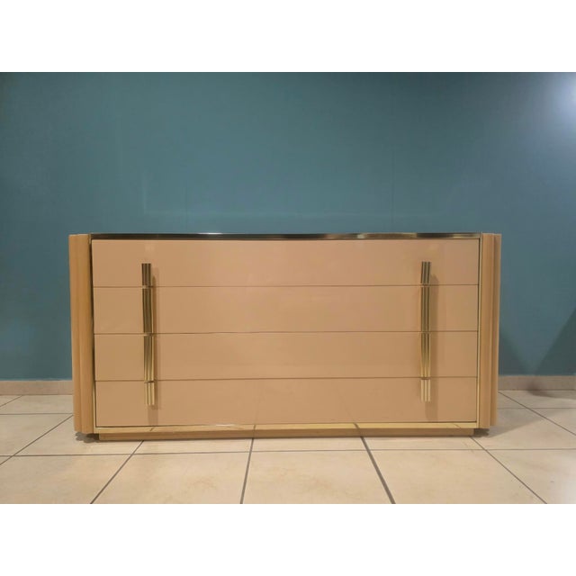 Chest of drawers designed by Alain Delon for Maison Jansen. Elegant French chest of drawers from the 1970s. Ivory in color...