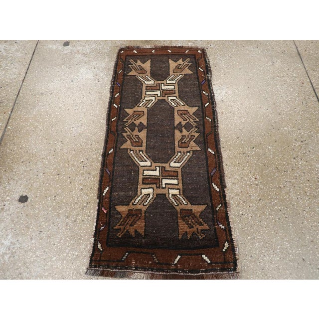 This Anatolian ruglet, originally intended as part of a pair for cushion covers, features symmetric knots made of wool and...