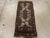 This Anatolian ruglet, originally intended as part of a pair for cushion covers, features symmetric knots made of wool and...